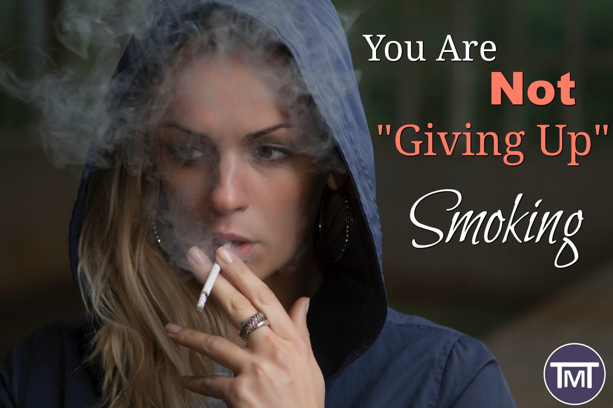 woman in blue hoodie holding cigarrette about to smoke it - You are not giving up smoking feature