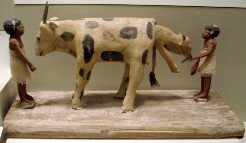 woodcarving egyptian cow giving birth