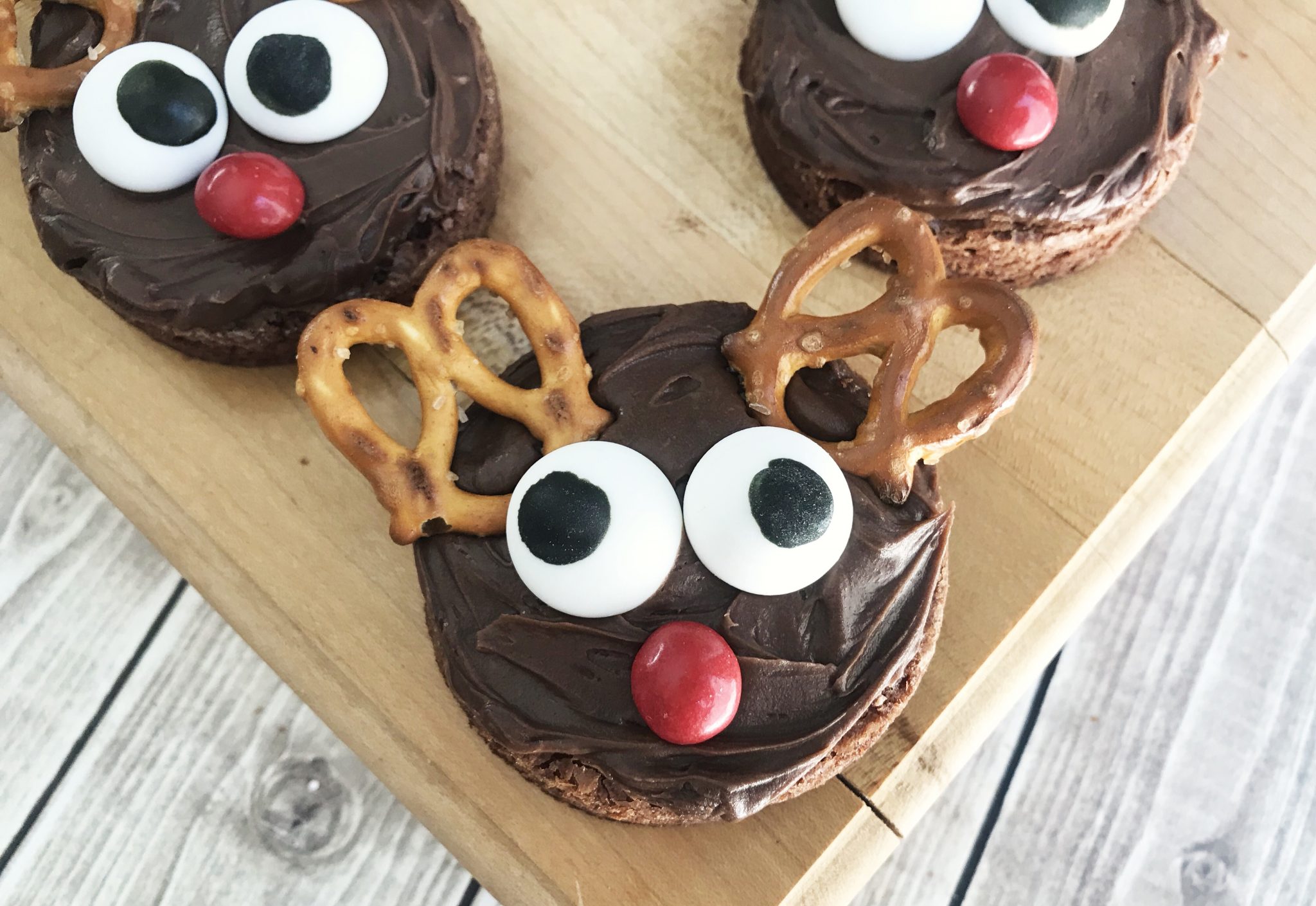 reindeer brownies on a chopping board with background - feature image